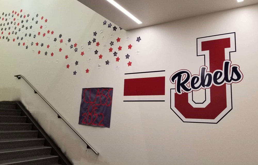 The Juanita High School interior graphics package features vibrant cut vinyl installed on the walls.